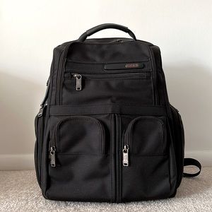 Black TUMI backpack. Comes with a portfolio and accessories case.